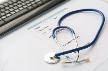 Medical desk with stethoscope and computer keyboard