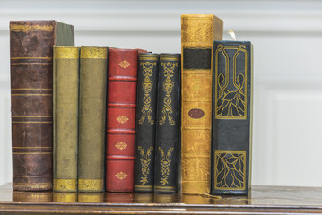 A stack of old books on the coffee table.