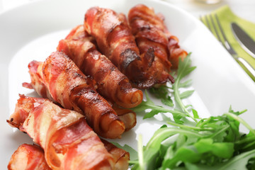 Plate with bacon wrapped chicken nuggets, closeup