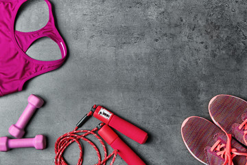 Composition with jumping rope on grey background