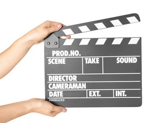Female hands with clapperboard against white background