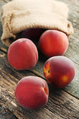 Ripe and sweet nectarines fruit on wooden table