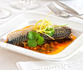 Mackerel prepared with a seafood sauce.