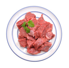 Raw beef meat isolated in plate on white