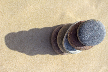 Pyramid of pebbles on sand