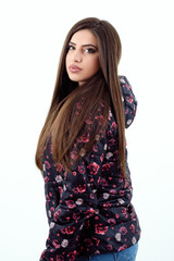 Beautiful young girl wearing a colorful winter jacket