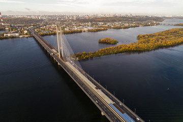 Fototapeta na wymiar Beautiful scenery of the Southern bridge aerial view at autumn. The bridge across the Dnieper River. Kiev. Ukrain.