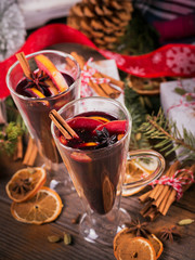Mulled wine with fruits, cinnamon sticks, anise and decorations