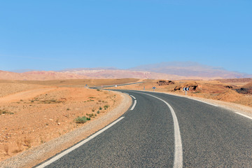 Fototapeta na wymiar landscape of empty highway in Sahara desert in Morocco 