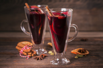 Mulled wine with fruits, cinnamon sticks, anise and decorations