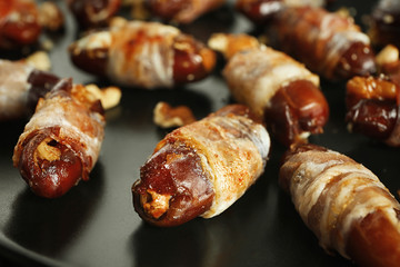 Plate with bacon wrapped dates, closeup