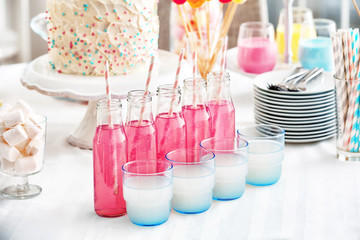 Glassware with colorful drinks on buffet table