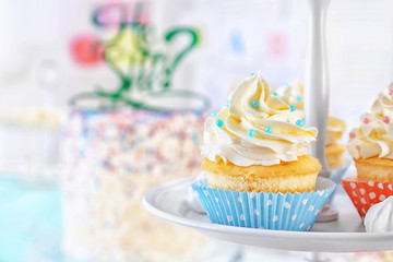 Delicious cupcakes on stand, closeup