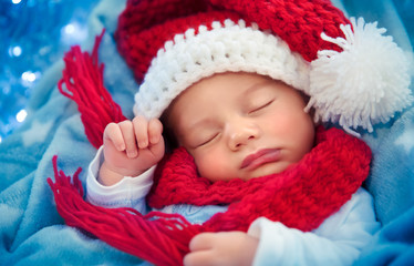 Newborn baby sleeping on Christmas eve