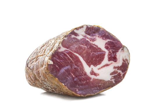 Corsican traditional delicatess coppa on a white background