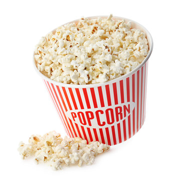 Cup with popcorn on white background