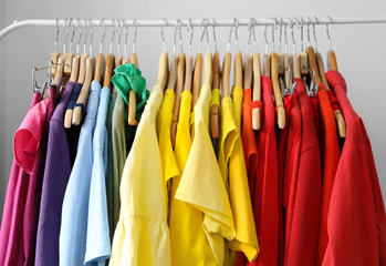 Rack with rainbow clothes, close up