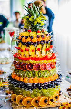 Rich table served with different kinds of fruits