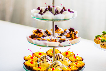 Yellow and chocolate cupcaces on a festive table