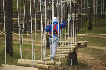 Boy climbing rope
