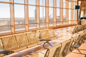 Waiting room with empty seats in modern airport