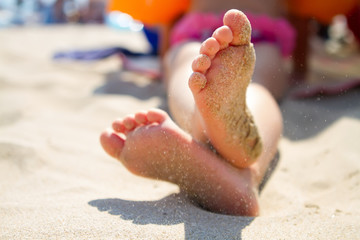 Child's feet in the sand