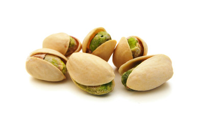 toasted pistachios on a white background