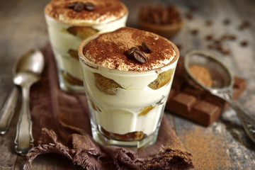 Homemade traditional italian dessert tiramisu with mascarpone cheese,savoyardi biscuit,coffee and whipped cream.