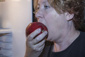 Woman eating apple