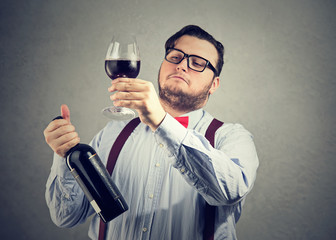 Snobby wine expert exploring drink