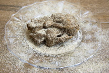 Apple fritter with cinnamon sugar on crystal plate