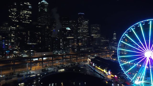 Bright Waterfront Lights and Skyscraper Buildings in Seattle Night Aerial