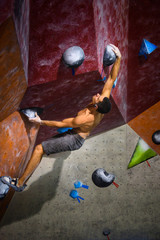 Sports and fitness. strong muscular athletic man working out in a gym.