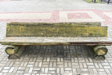 Old wooden bench in the brutal style.