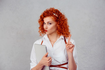 woman gesturing a no sign. Closeup portrait unhappy, serious red head retro style girl raising...