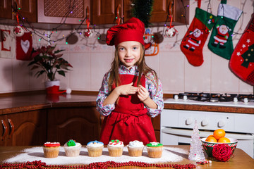 festive red apron Christmas party dinner dessert peppermint cupcakes cheese cream sugar sprinkling decoration girl new year red apron chef chief confectioner
