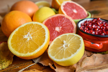 Fototapeta na wymiar Tropical fruit mix of citrus, lemon, orange, pomegranate 