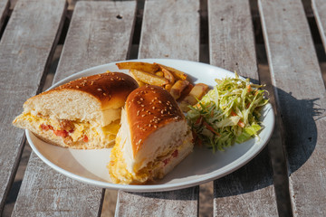 Close up club sandwich on wooden table, delicious meal breakfast.