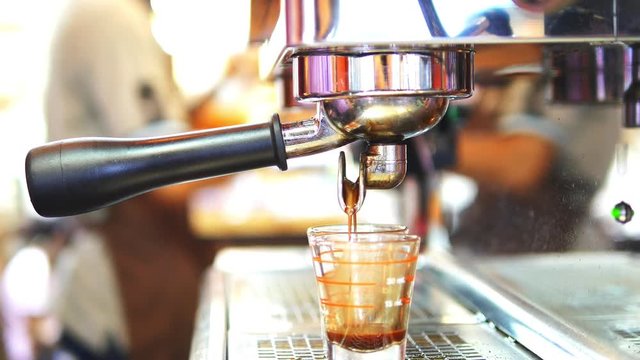 Closeup of tea maker machine during making shots in coffee shop