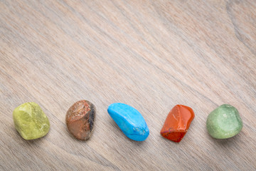 row of semiprecious colorful polished gemstones