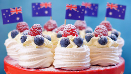 Australian mini pavlovas and flags in red, white and blue for Australia Day or national holiday party food treats. 
