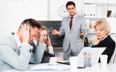 Angry boss blowing up his subordinates
