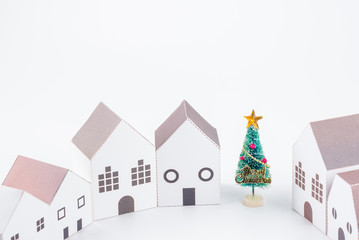 Christmas tree in the paper house town isolated on white background with copy space.Christmas day concept.