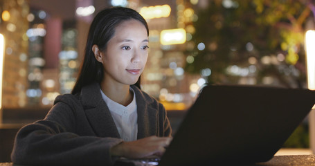 Asian businesswoman work on laptop computer at night