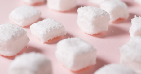 Fototapeta na wymiar Marshmallow candy on pink background