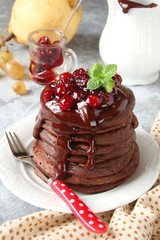 chocolate pancakes with cranberry jam, chocolate and mint