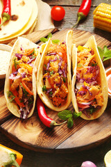 Mexican food tacos, fried chicken, greens, mango, avocado, pepper, red cabbage