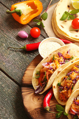 Mexican food tacos, fried chicken, greens, mango, avocado, pepper, red cabbage