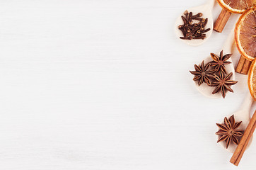 Christmas spices for mulled wine on wood white board, top view, copy space.