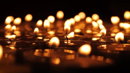 Tealight candles burning macro 4K